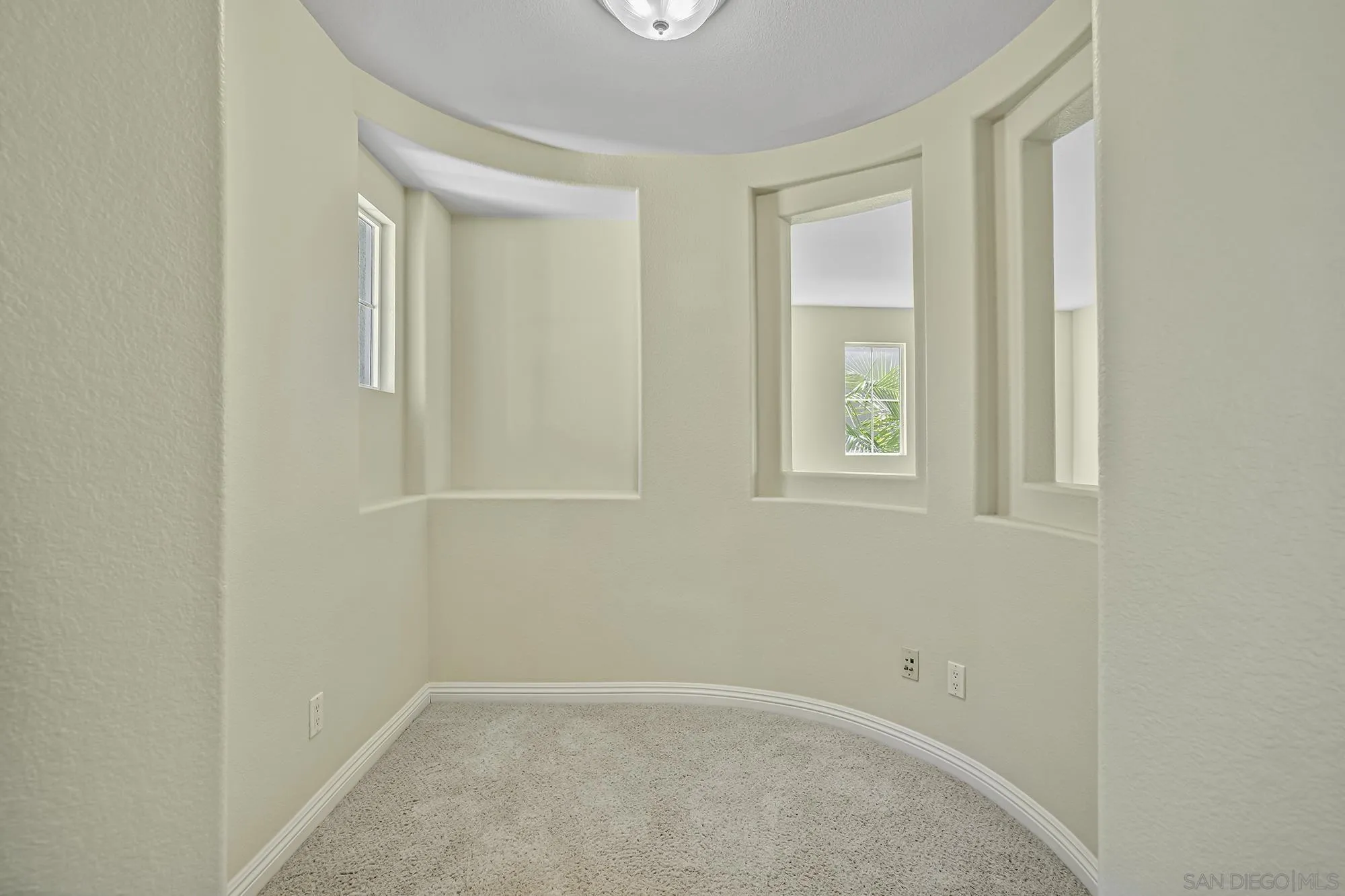 7065 Crystalline Drive Carlsbad, CA 92011 - Photo 21 of 26 an empty room with windows and closet