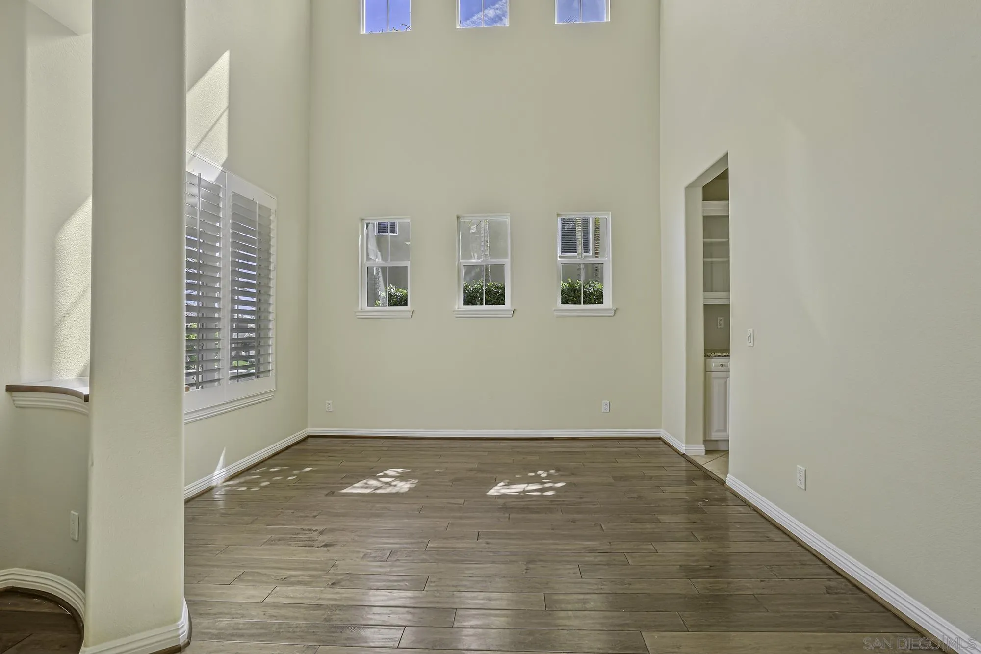 7065 Crystalline Drive Carlsbad, CA 92011 - Photo 3 of 26 an empty room with windows