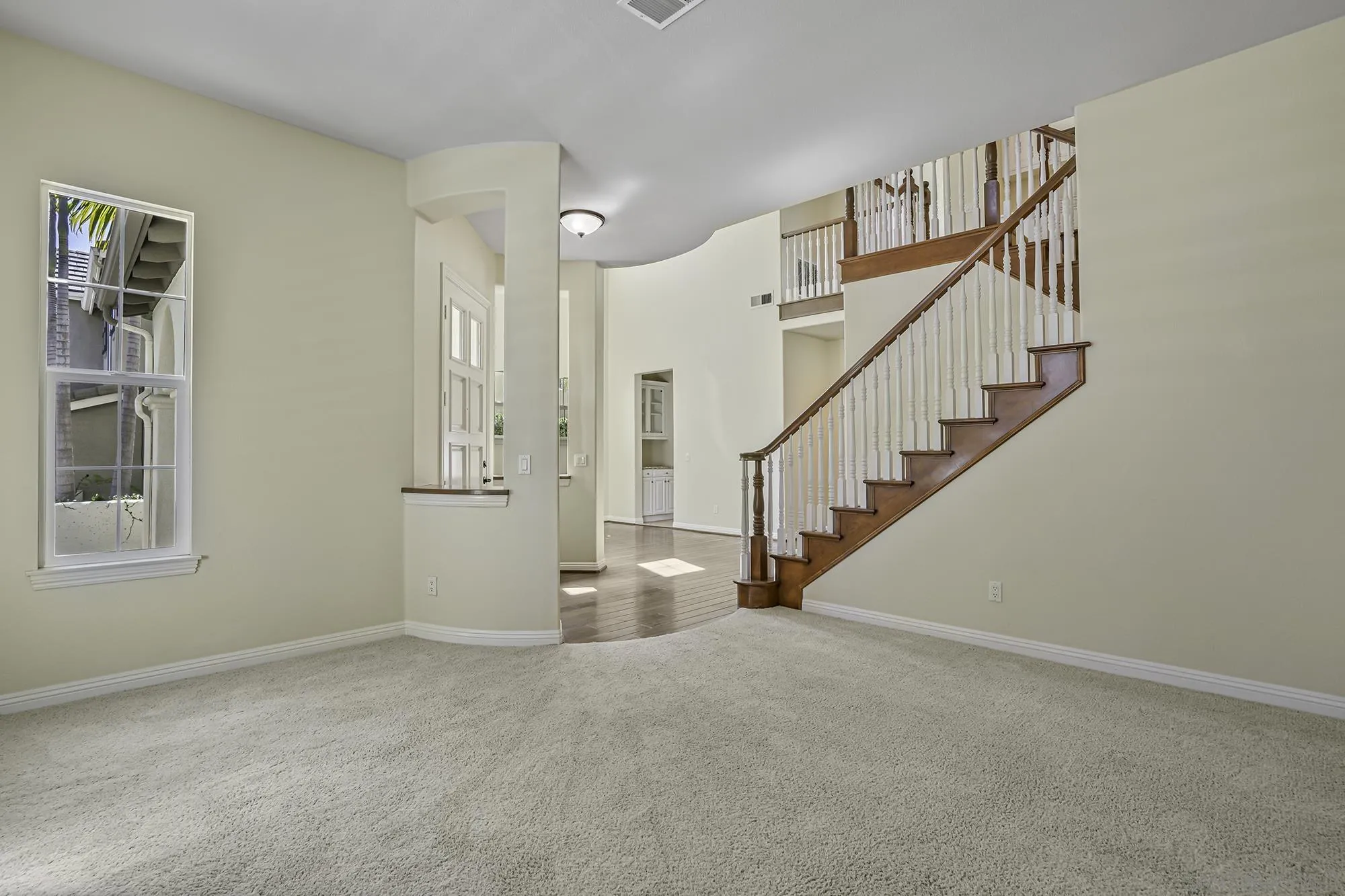 7065 Crystalline Drive Carlsbad, CA 92011 - Photo 6 of 26 a view of entryway and hall with wooden floor