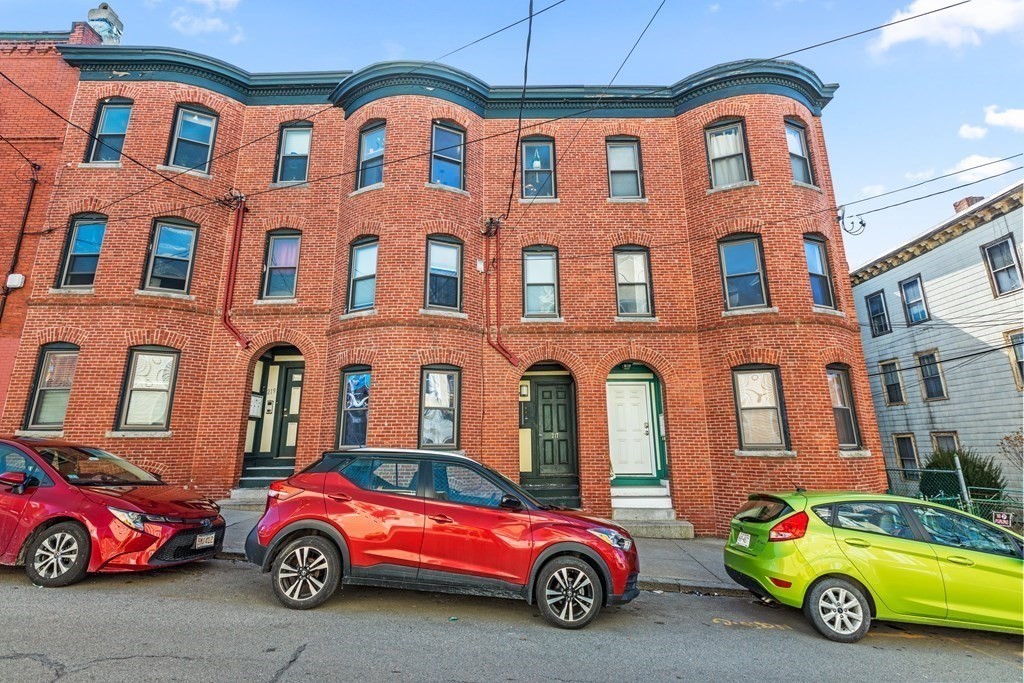 217 Boylston Street, Unit 3 Boston, MA 02130 - Photo 3 of 18 a front view of a residential apartment building with parking space