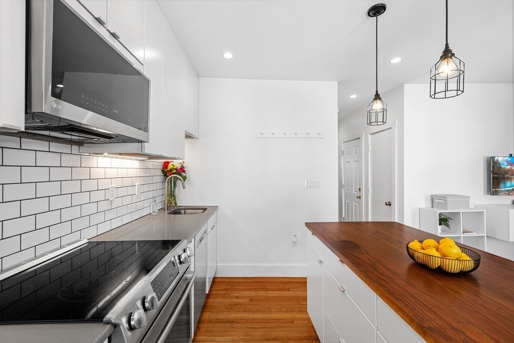 217 Boylston Street, Unit 3 Boston, MA 02130 - Photo 7 of 18 a bathroom with a sink and a mirror
