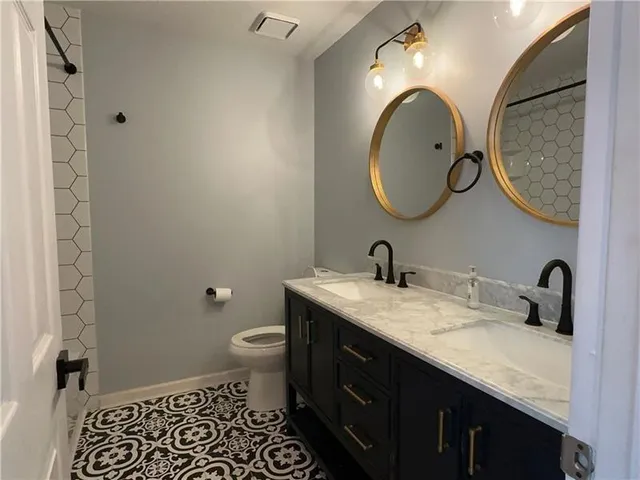 a bathroom with a bathtub and shower