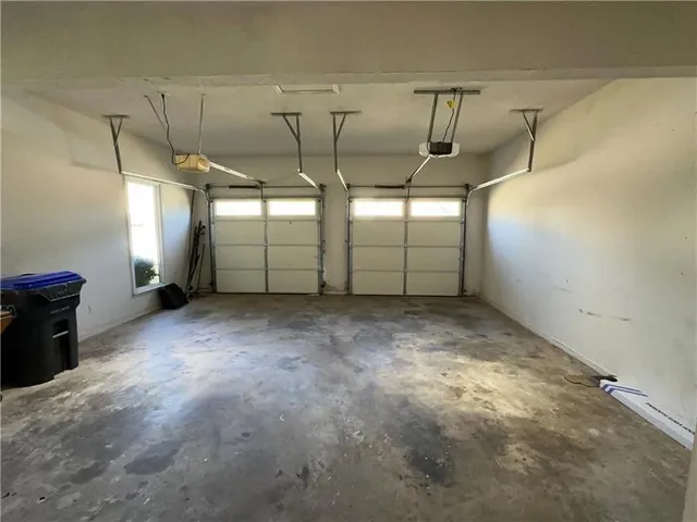 a bathroom with a granite countertop toilet a sink and a mirror