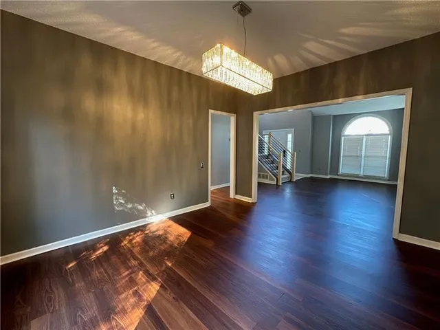 a view of hallway with wooden floor