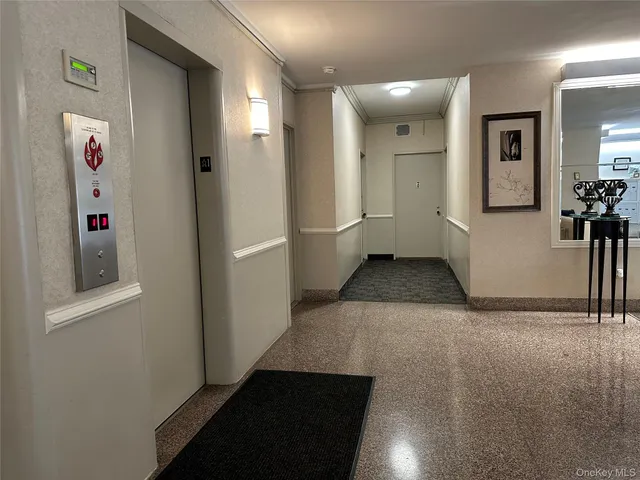 a view of a hallway with seating area