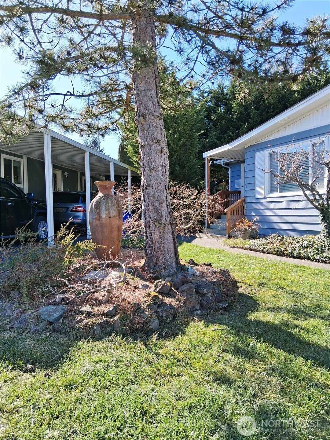 815 124th Street Southwest, Unit 36 Everett, WA 98204 - Photo 4 of 32 a view of a house with backyard from a patio