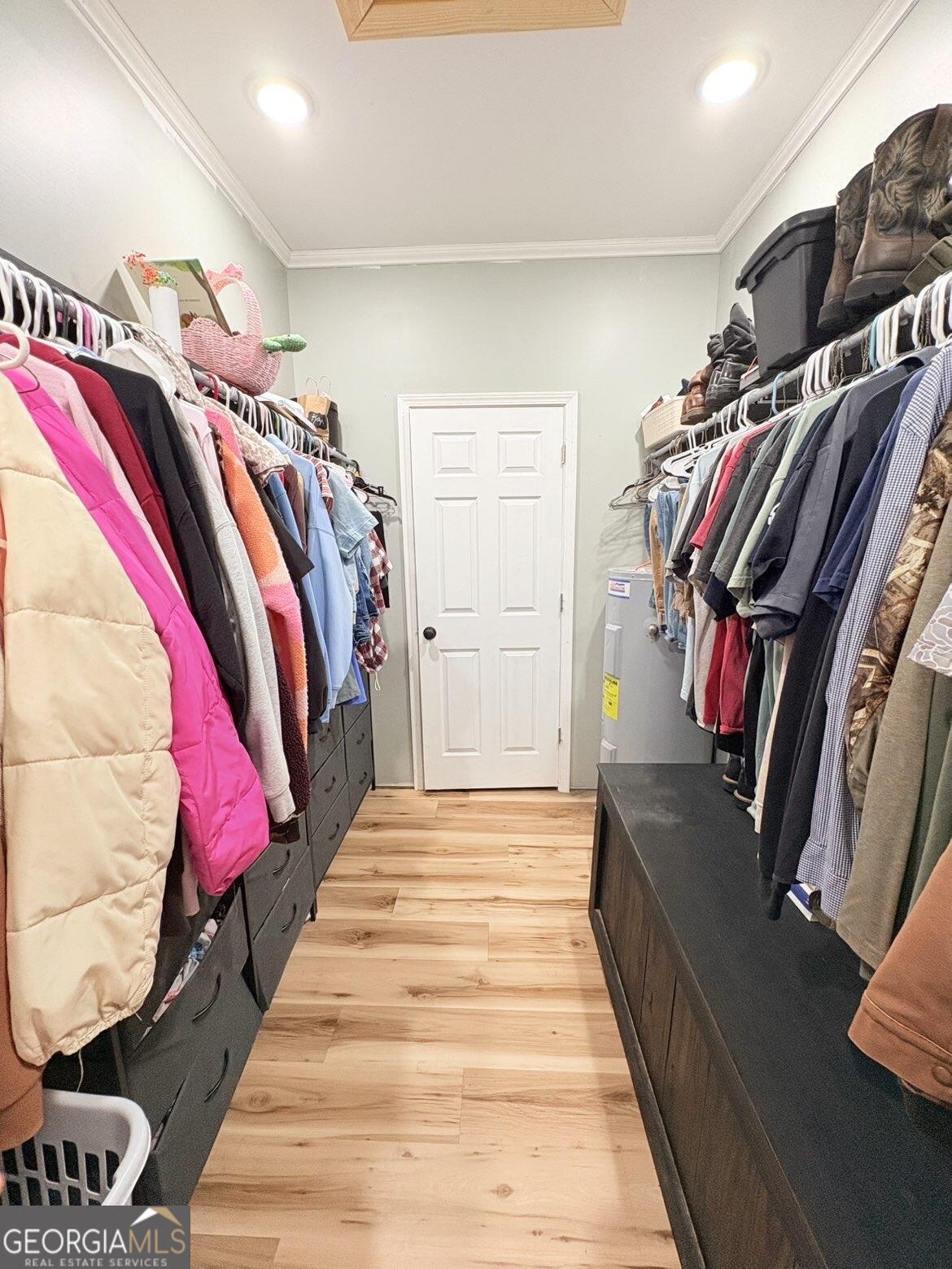 210 St Galilee Road Swainsboro, GA 30401 - Photo 13 of 18 a view of walk in closet with clothes and shoes