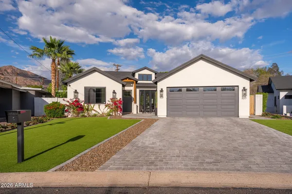 front view of a house with a yard