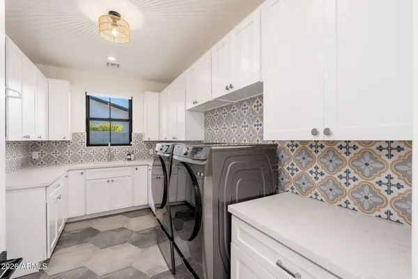 a utility room with dryer and washer