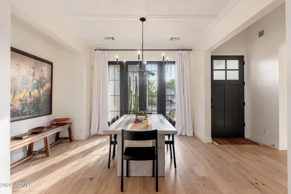 a dining room with furniture and window