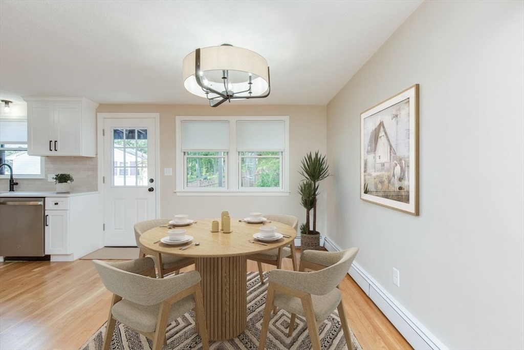 2 Oceanview Avenue Saugus, MA 01906 - Photo 11 of 41 a view of a dining room with furniture a chandelier and wooden floor