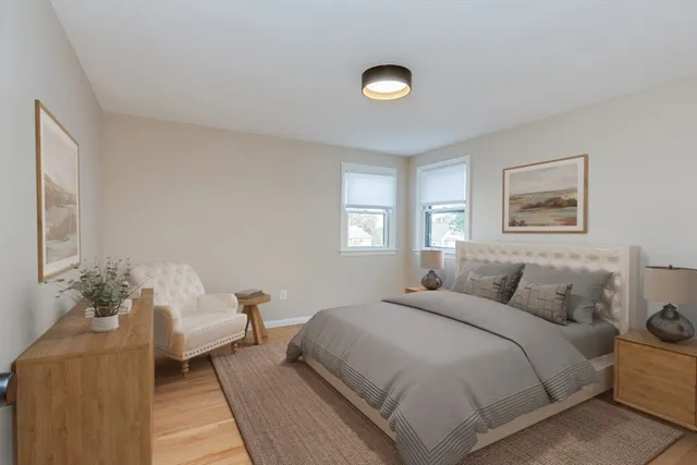 a bedroom with a bed and a couch