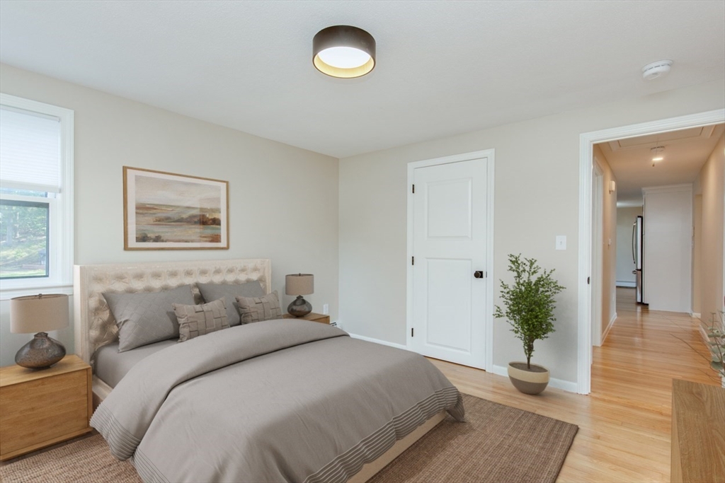 2 Oceanview Avenue Saugus, MA 01906 - Photo 19 of 41 a bedroom with a balcony and a potted plant