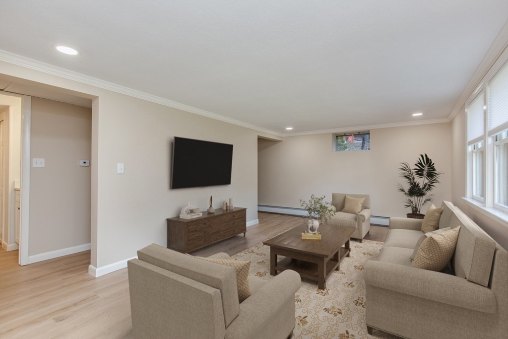 2 Oceanview Avenue Saugus, MA 01906 - Photo 28 of 41 a living room with furniture and a flat screen tv