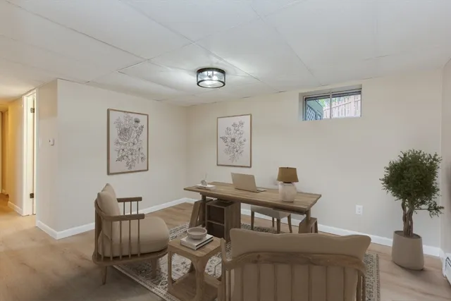 a view of a livingroom with furniture and a potted plant