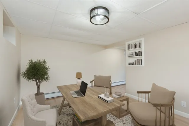 a view of a dining room with furniture and chandelier