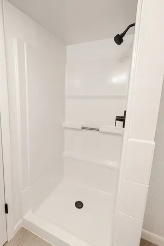 a view of a deck with couches and wooden floor