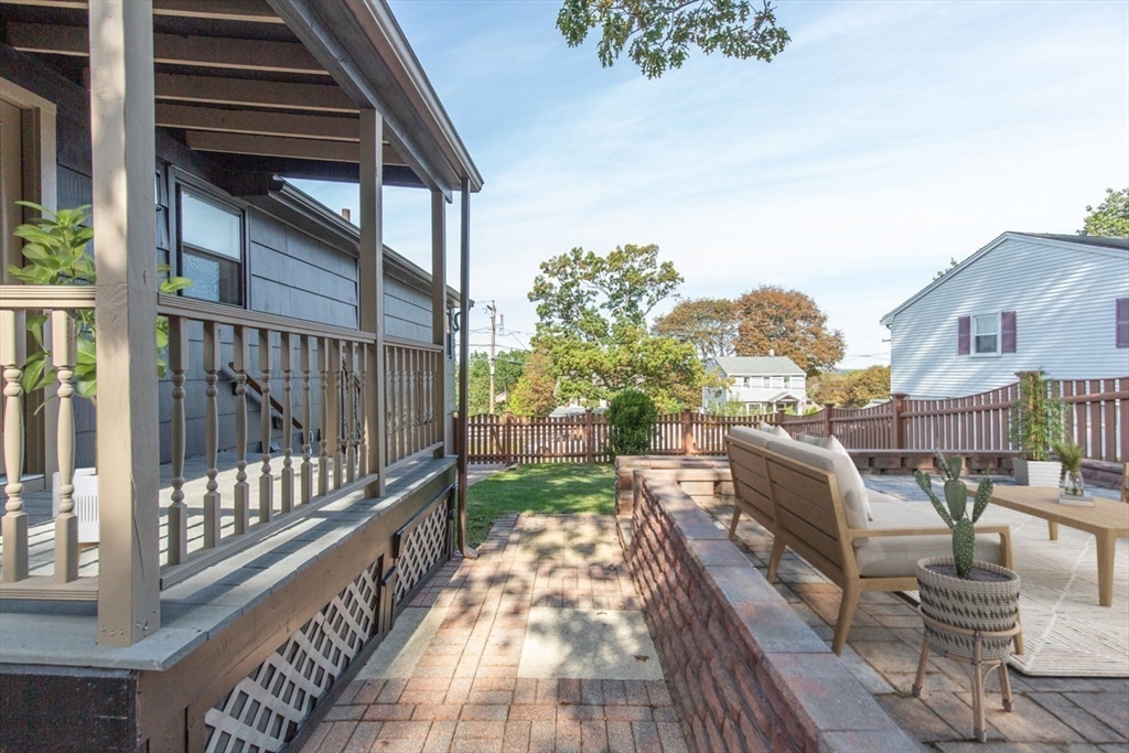 2 Oceanview Avenue Saugus, MA 01906 - Photo 41 of 41 a view of a patio with couches table and chairs and potted plants