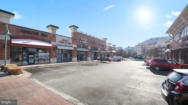 a view of street with an entrance and a potted plant