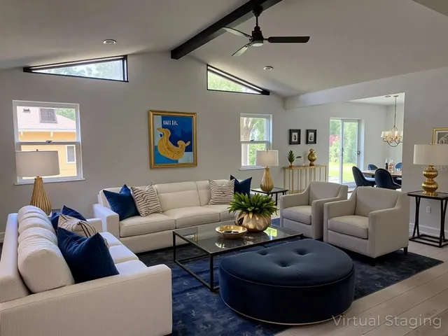 a living room with furniture a rug and a chandelier