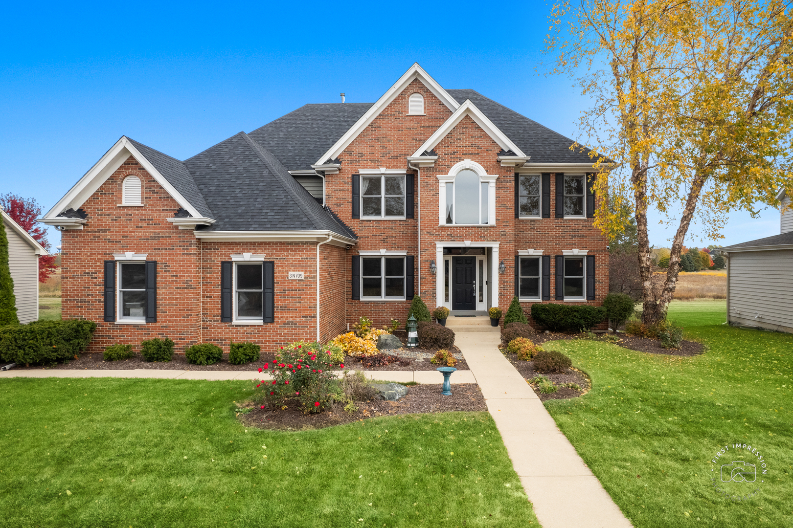 a front view of a house with a yard