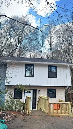a front view of a house with garage