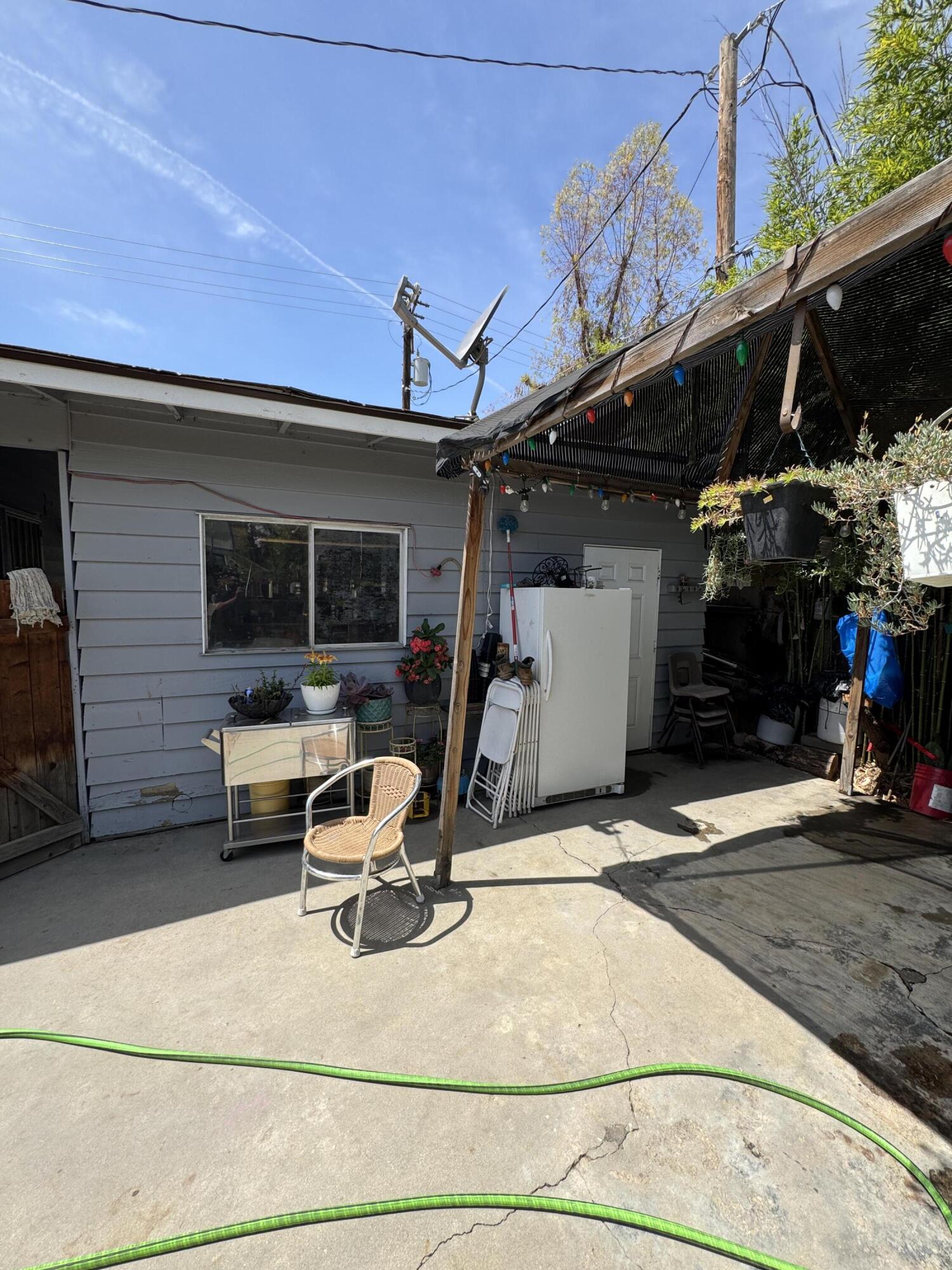 704 North Floral Street Visalia, CA 93291 - Photo 27 of 51 a view of a patio with table and chairs