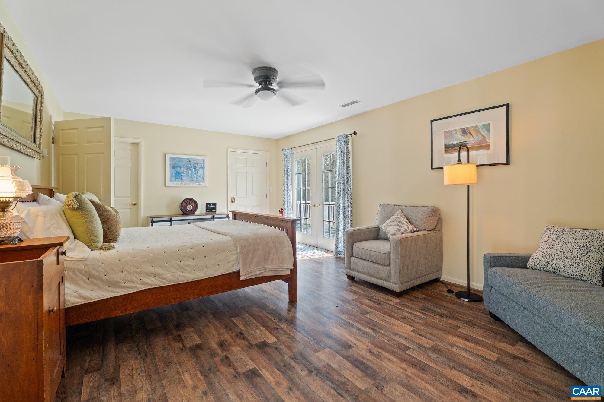 14910 Western Mill Road Lawrenceville, VA 23868 - Photo 65 of 73 a spacious bedroom with a bed and couch
