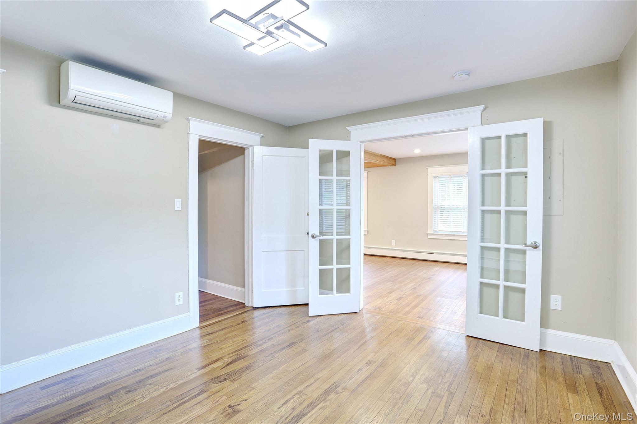 254 North Main Street New City, NY 10956 - Photo 9 of 37 an empty room with wooden floor and windows