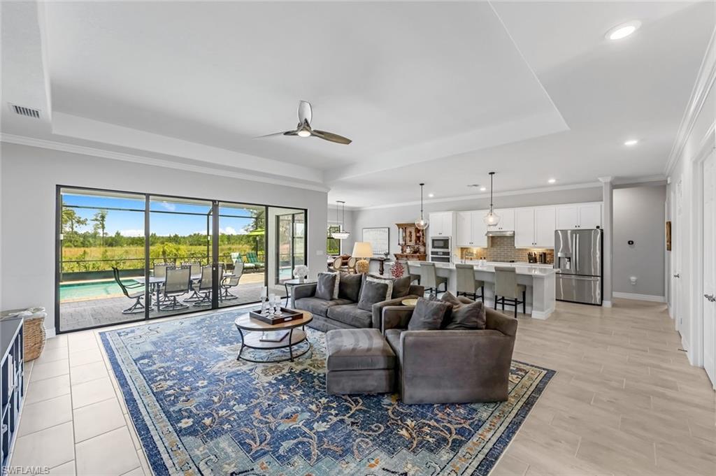19437 The Pl Boulevard Estero, FL 33928 - Photo 10 of 37 a living room with furniture and a large window