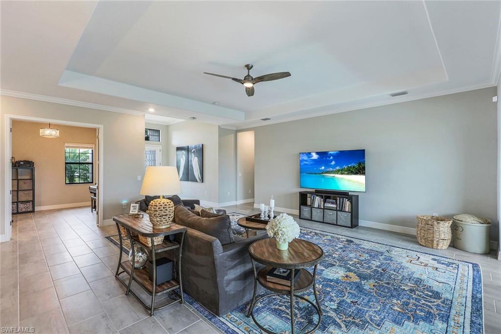 19437 The Pl Boulevard Estero, FL 33928 - Photo 11 of 37 a living room with furniture and a flat screen tv