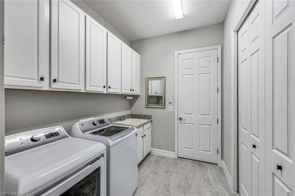 19437 The Pl Boulevard Estero, FL 33928 - Photo 21 of 37 a view of cabinets and wooden floor