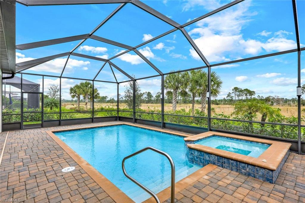 19437 The Pl Boulevard Estero, FL 33928 - Photo 24 of 37 a view of a swimming pool with a porch