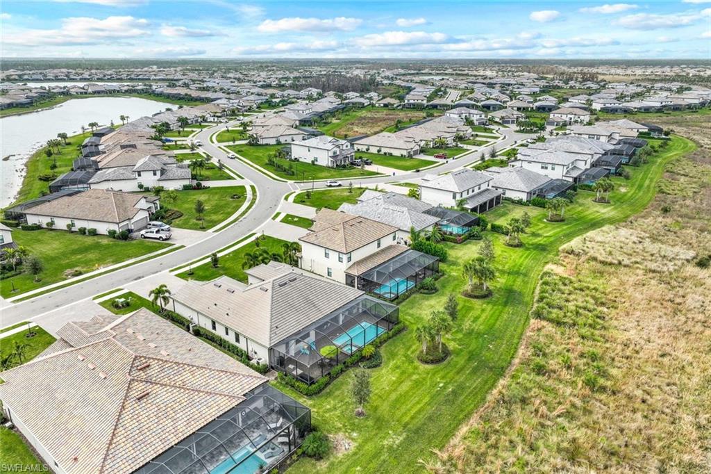 19437 The Pl Boulevard Estero, FL 33928 - Photo 32 of 37 an aerial view of residential houses with outdoor space