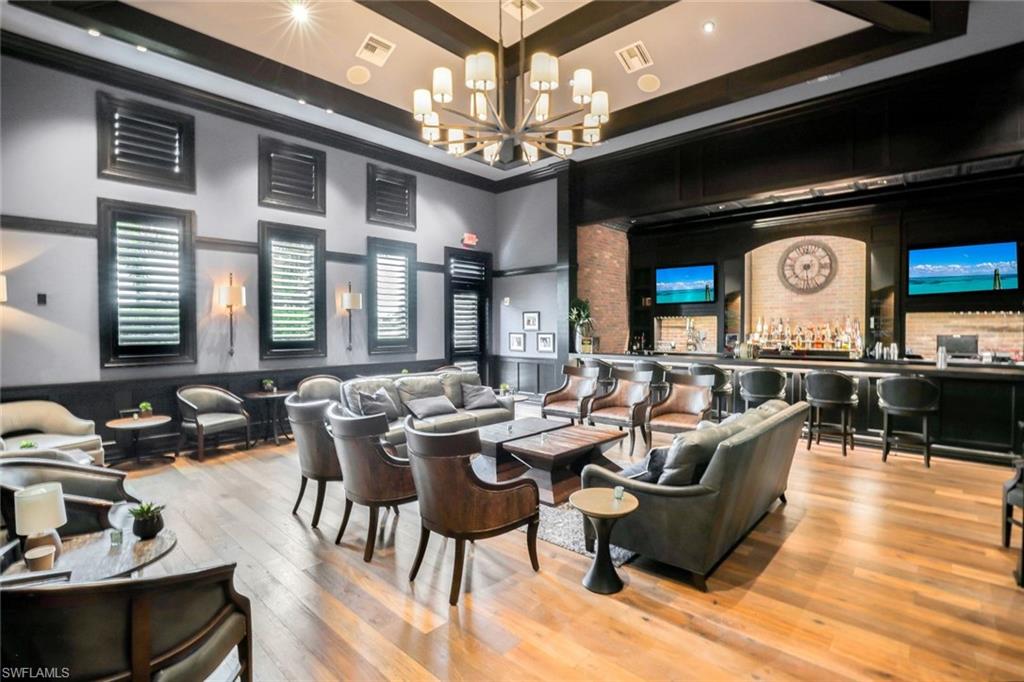 19437 The Pl Boulevard Estero, FL 33928 - Photo 36 of 37 a living room with fireplace furniture and a large window