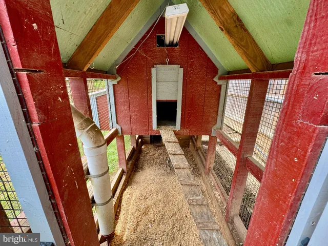 a view of backyard with wooden fence