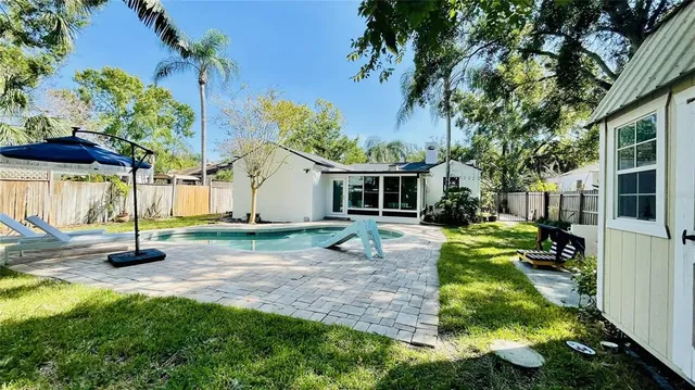 a view of a swimming pool with a patio
