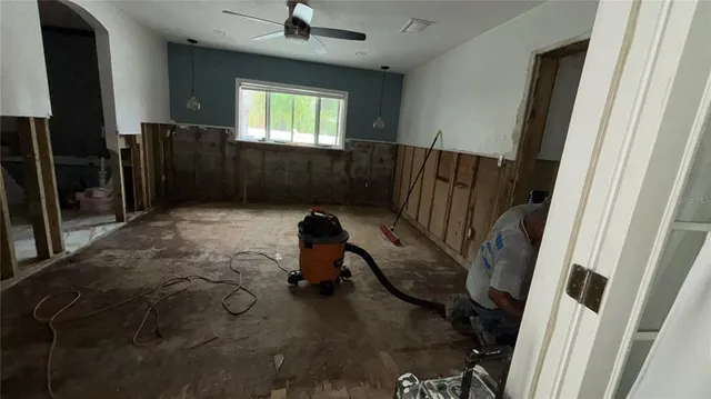 a view of house and a swimming pool with a yard