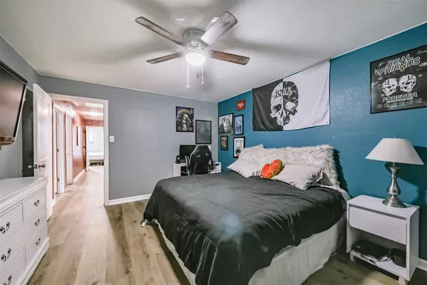 a bedroom with a bed and a desk