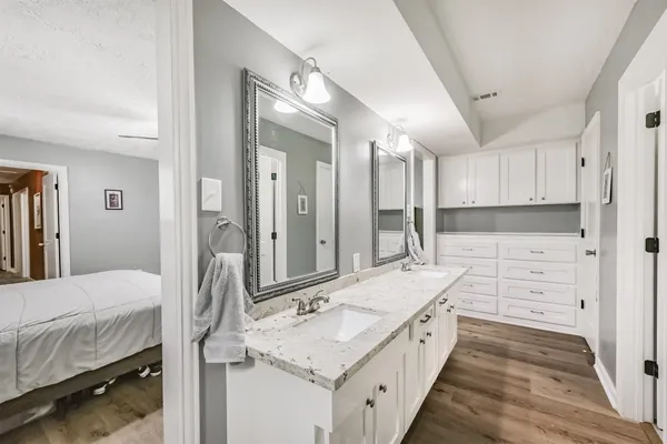 a bathroom with a double vanity sink mirror and double