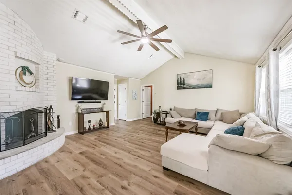 a living room with furniture and a flat screen tv