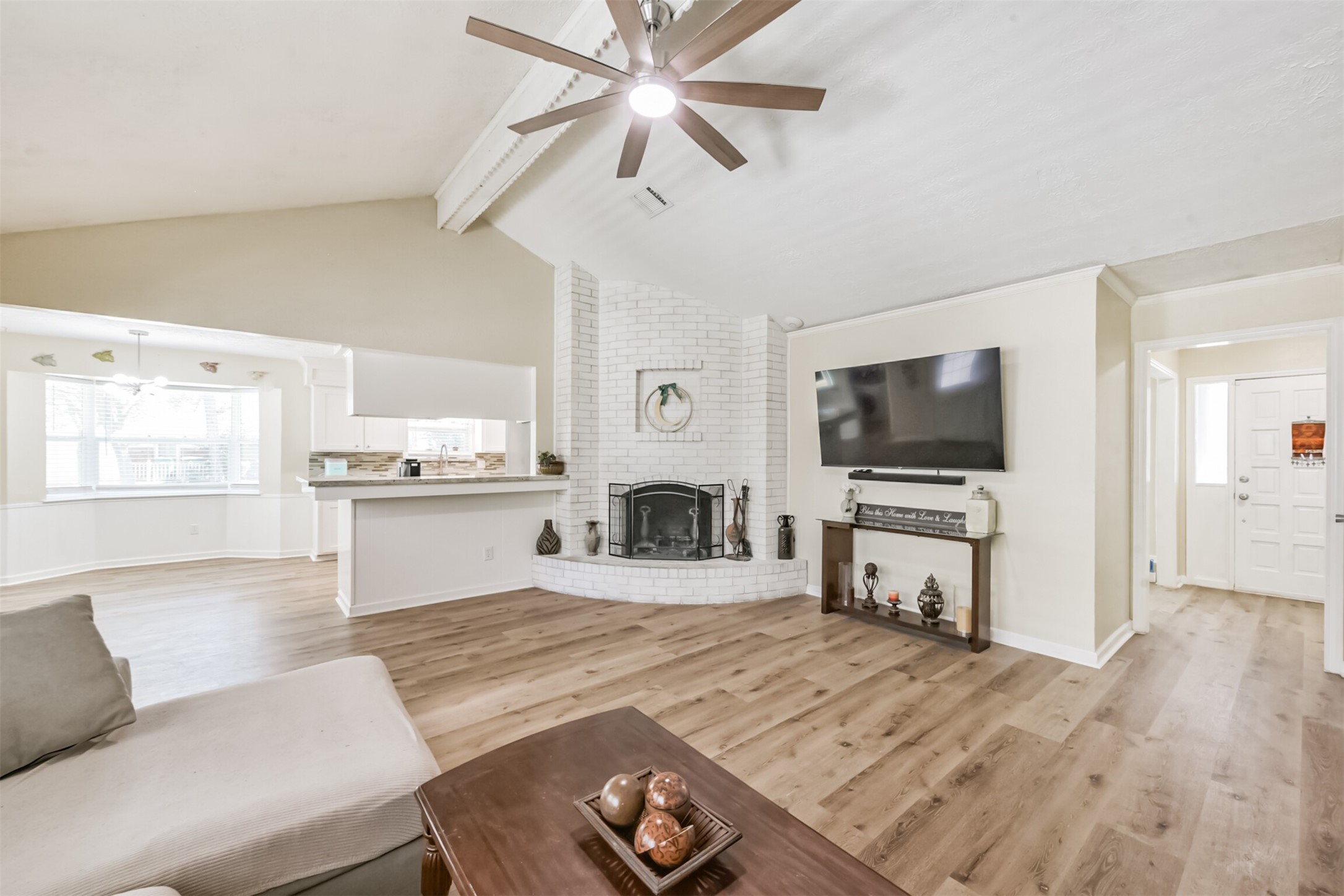 2011 North Palm Court Pasadena, TX 77502 - Photo 10 of 39 a living room with furniture a flat screen tv and a fireplace