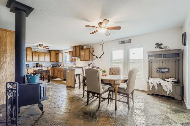 a kitchen with a table and chairs