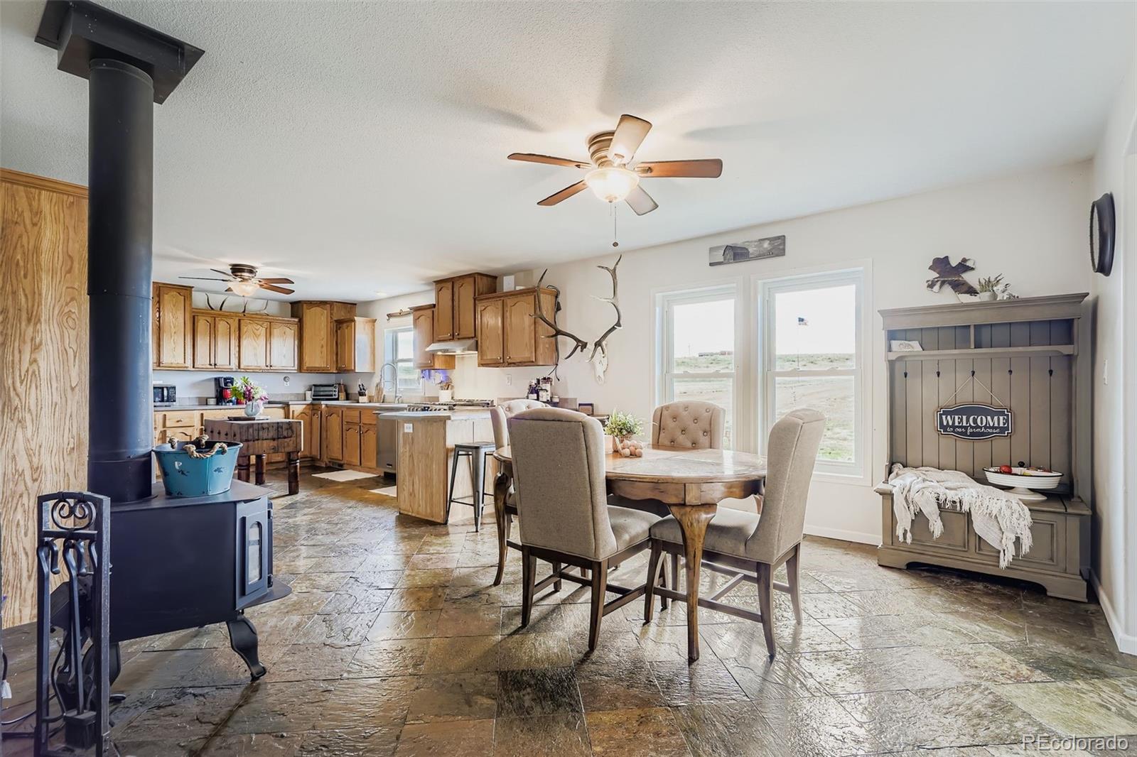 26540 Flower Circle Simla, CO 80835 - Photo 14 of 40 a living room with furniture and a chandelier