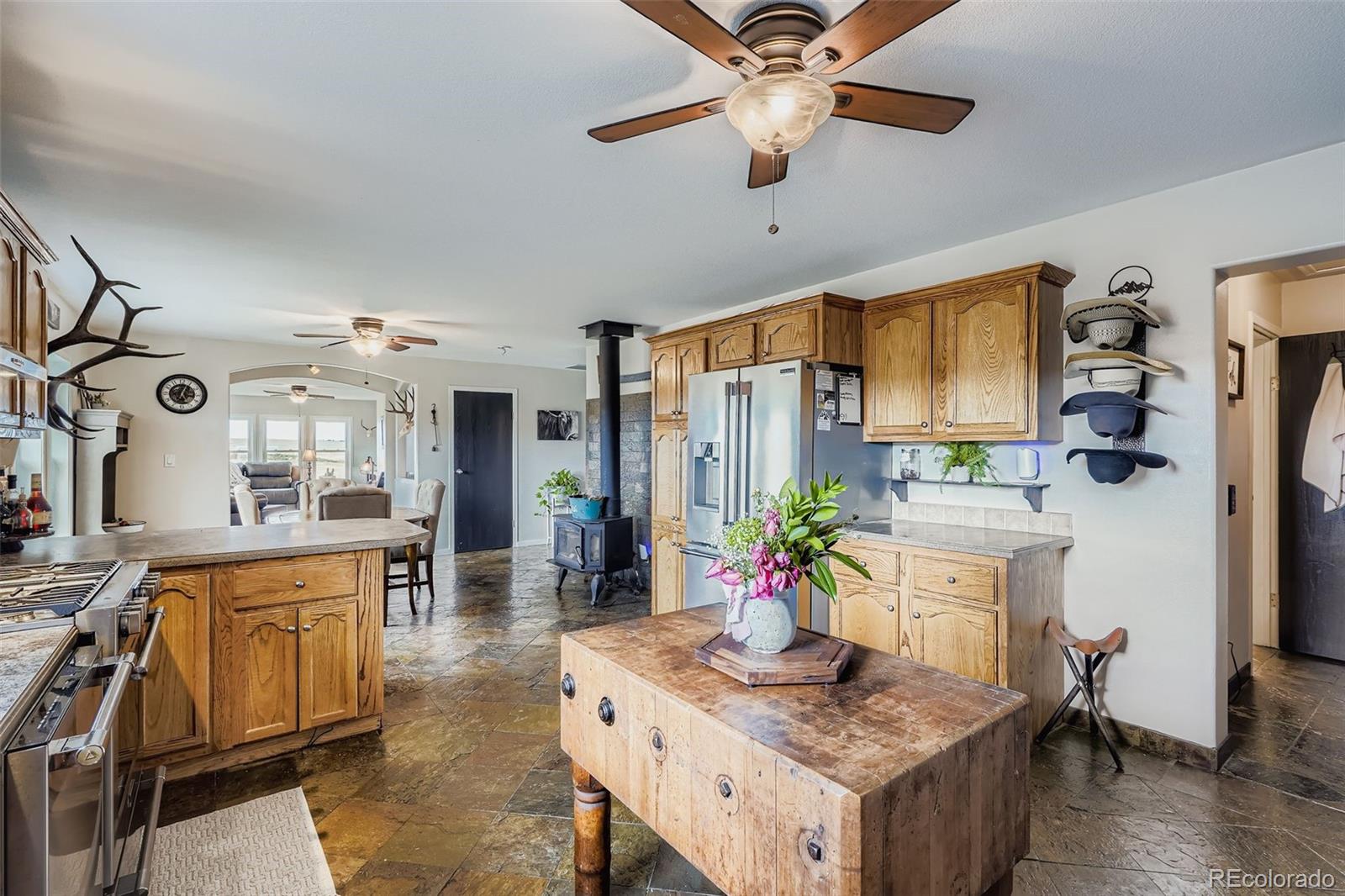 26540 Flower Circle Simla, CO 80835 - Photo 16 of 40 a kitchen with a table and chairs