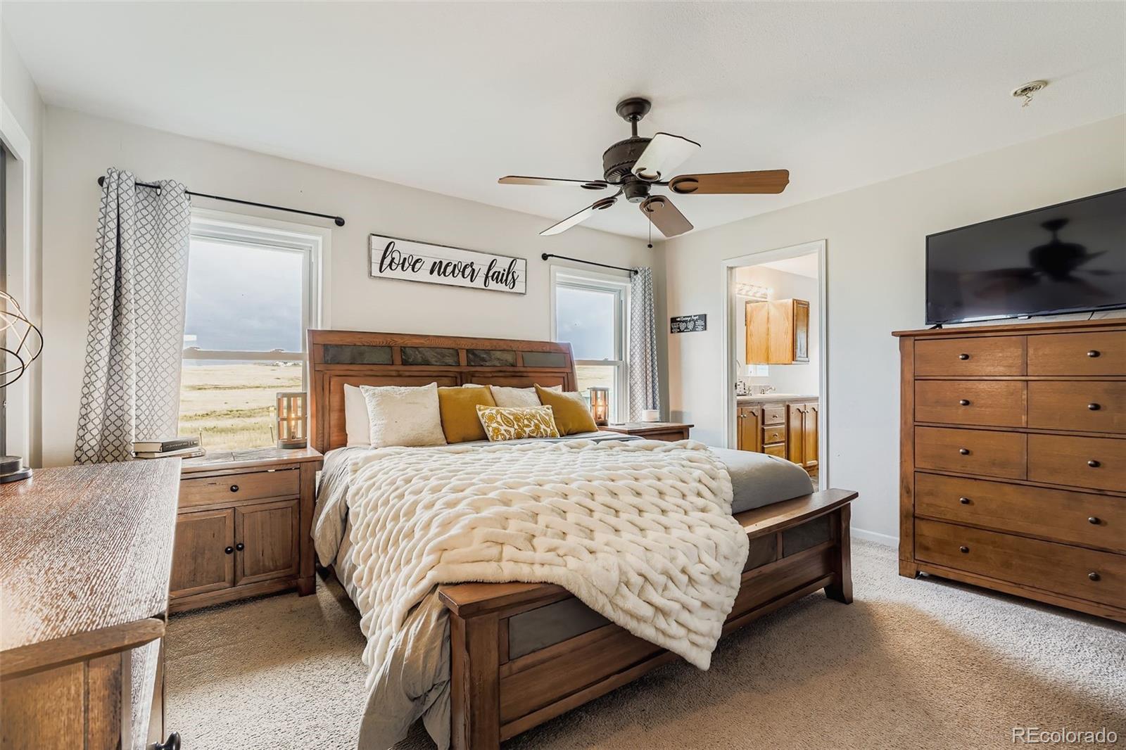 26540 Flower Circle Simla, CO 80835 - Photo 18 of 40 a bedroom with a bed a window and dresser