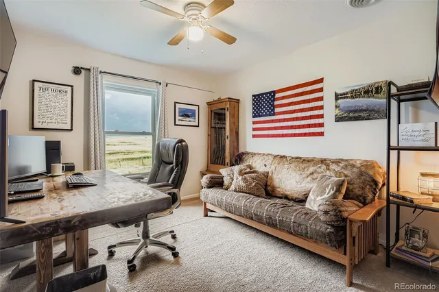 a bedroom with a bed and a table