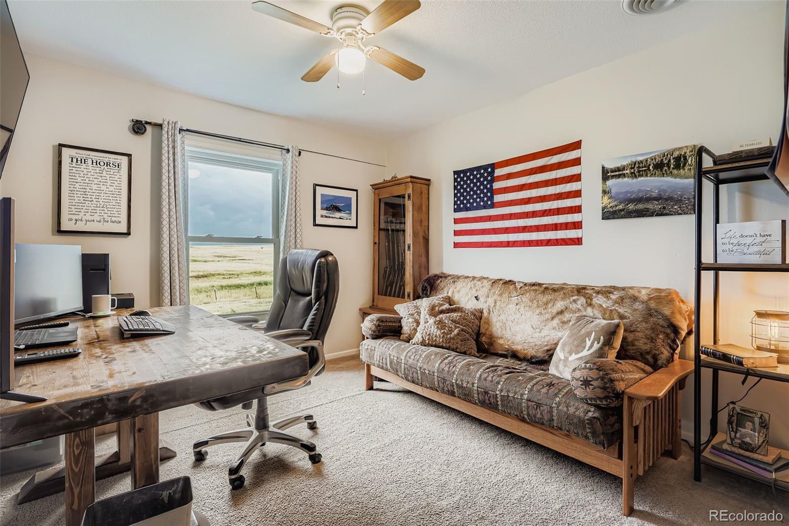 26540 Flower Circle Simla, CO 80835 - Photo 23 of 40 a living room with furniture and a flat screen tv