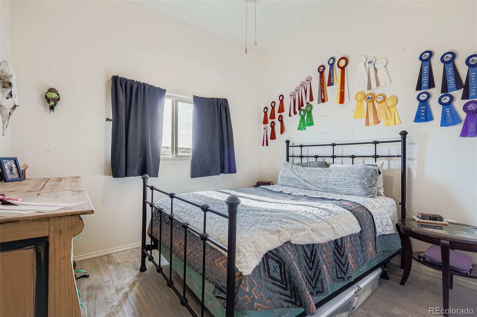 26540 Flower Circle Simla, CO 80835 - Photo 25 of 40 a bedroom with a bed and a table