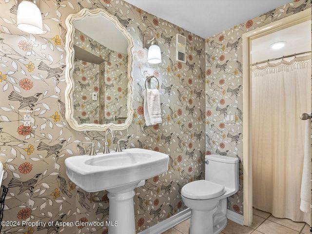 a view of a dinning table and chairs in the balcony